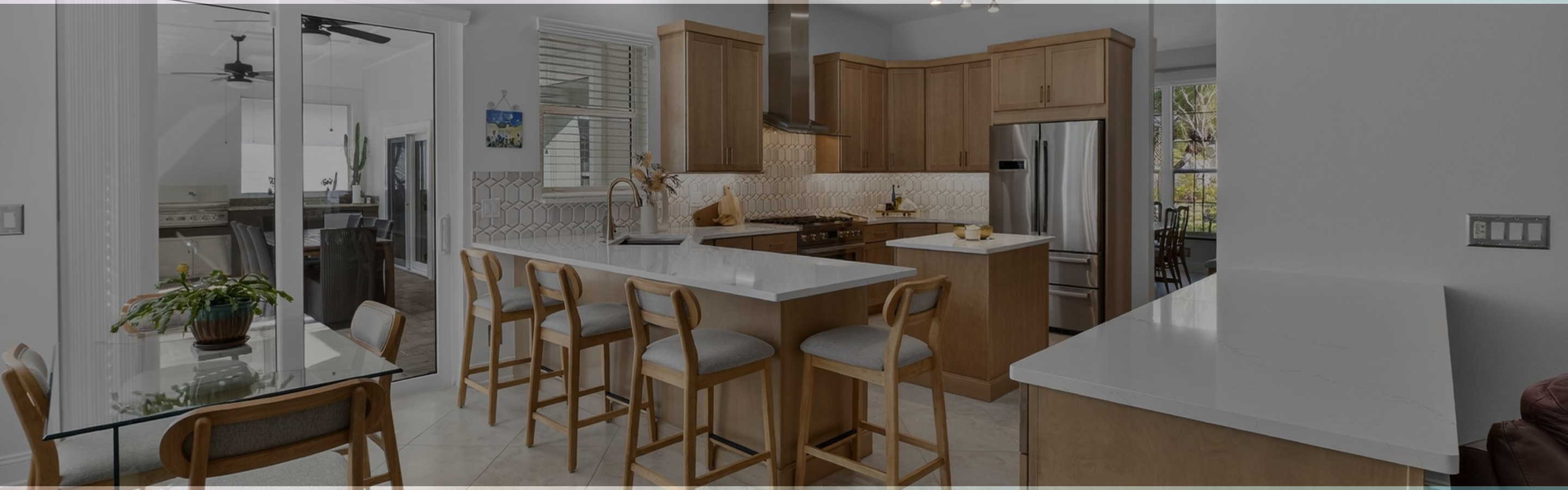Kitchen remodel with tile backsplash, quartz countertops, and cabinetry in Westchase, FL