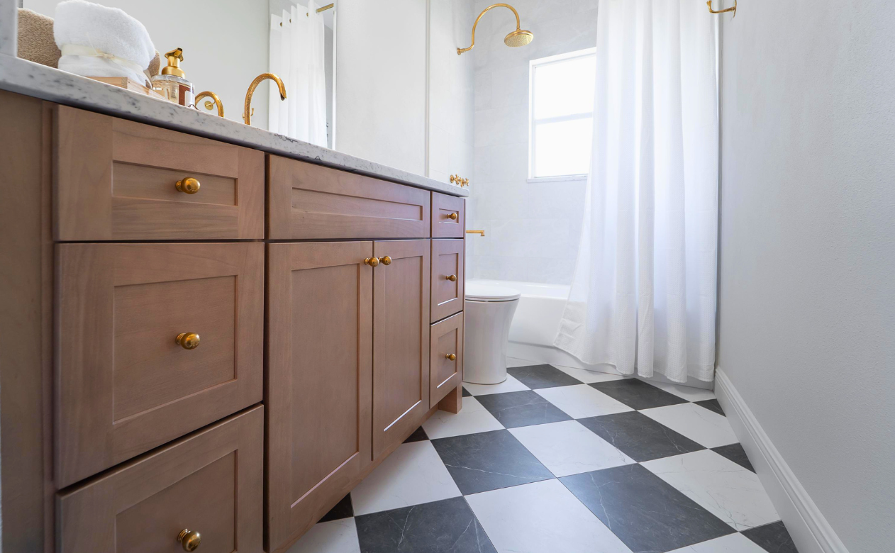 Black and white checkerboard tile flooring in a bathroom remodel in Lutz, FL