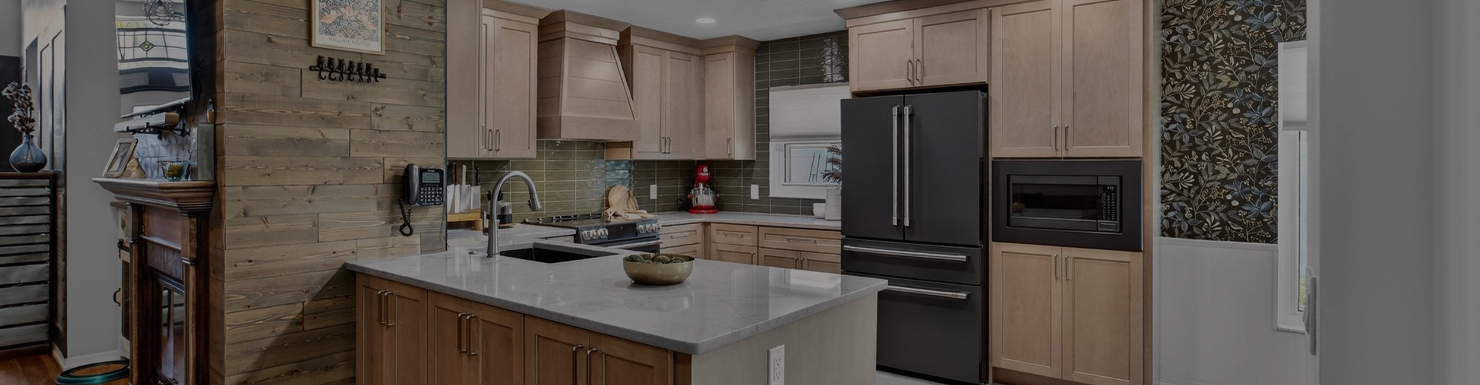 Kitchen remodel with custom cabinetry, black built-in appliances and quartz countertops