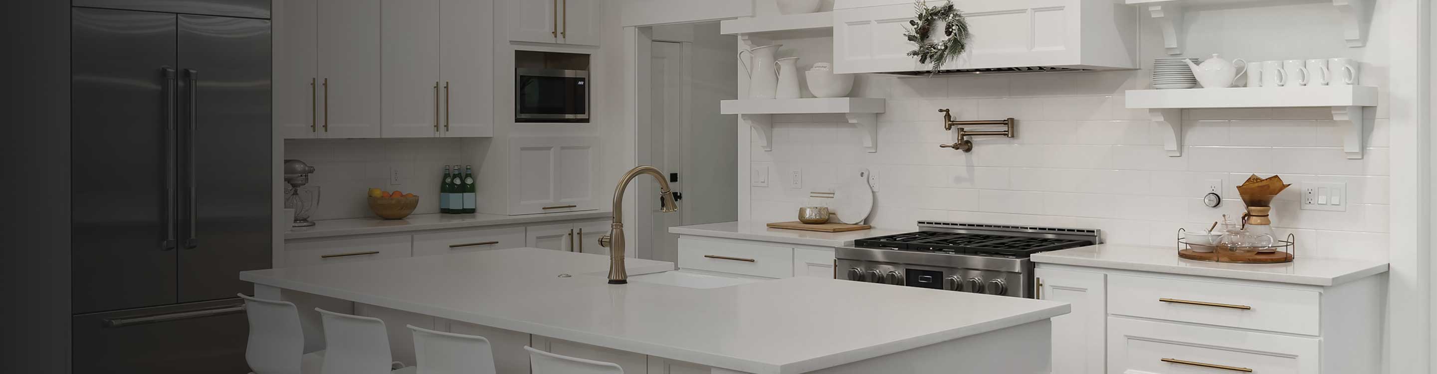 white cabinetry and countertops in a kitchen