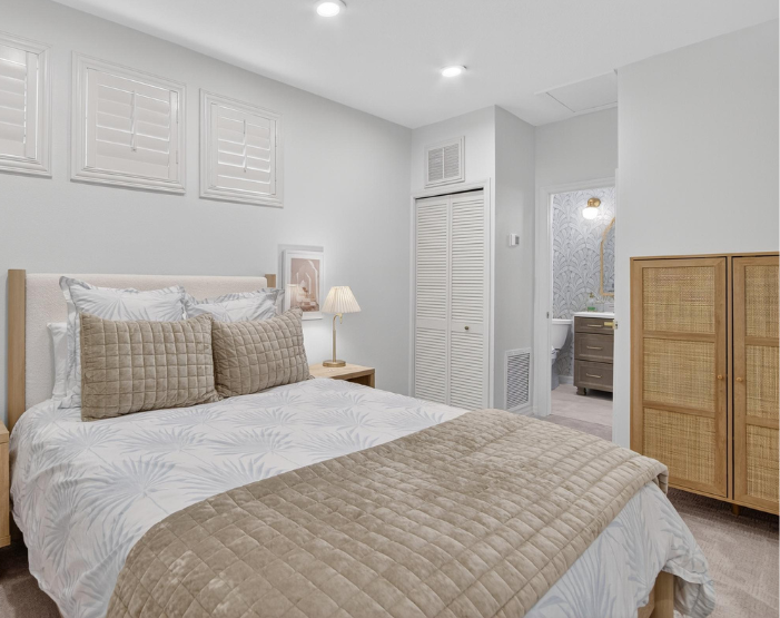 Bedroom with new carpet and ensuite bathroom in Westchase, FL