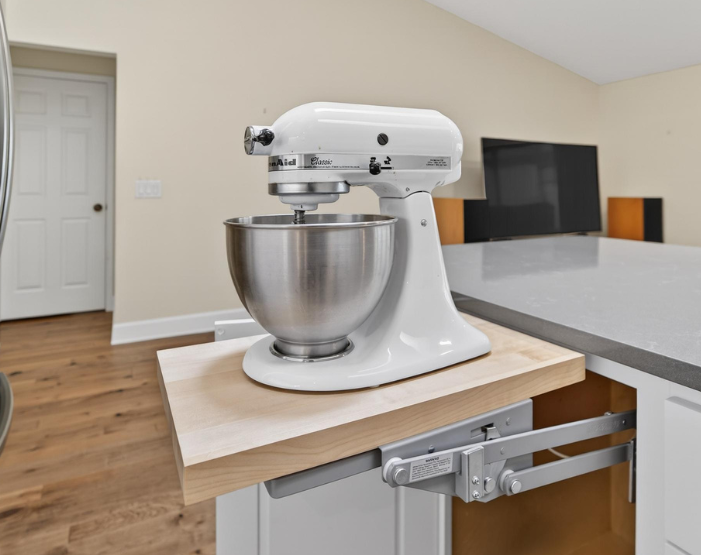Built-in kitchenaid mixer lifts in a cabinet from Hanover Floors Kitchen & Bath