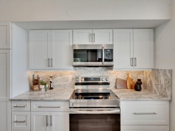 Tampa kitchen renovation with white cabinets and stone counters